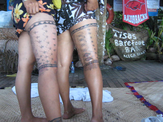 Traditional Samoan malu leg tattoos showing intricate geometric patterns