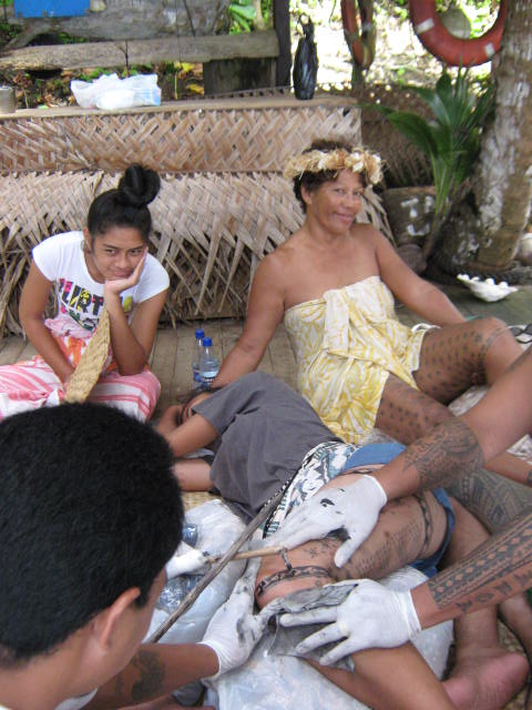Traditional Samoan tattooing being performed with hand tools